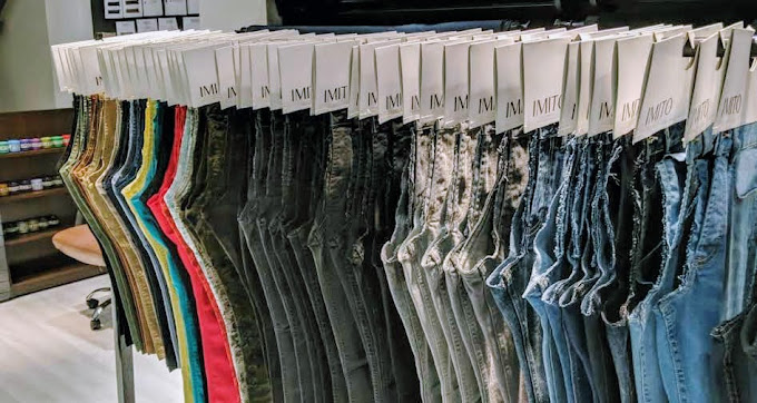 Rows of denim fabrics and finished IMITO jeans